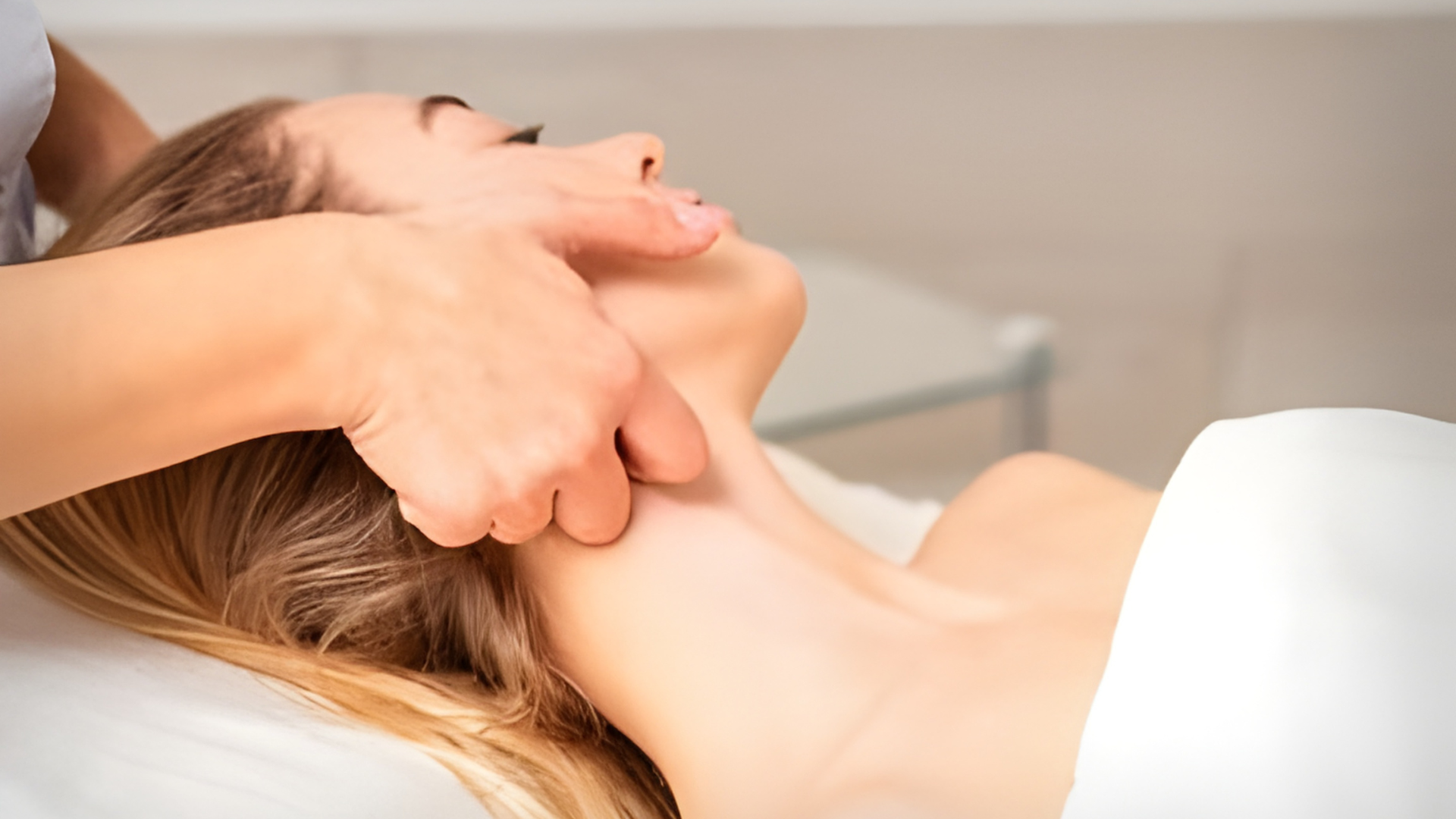 Therapist performing Manual Lymphatic Drainage on a client